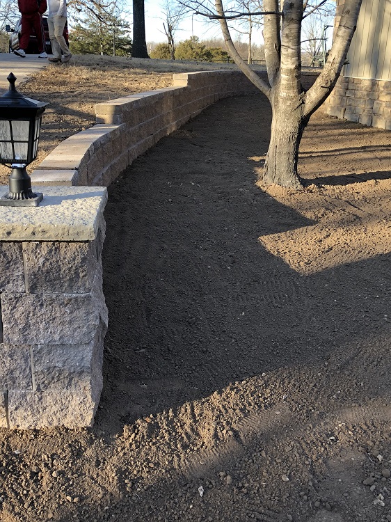 Lantern on retaining wall